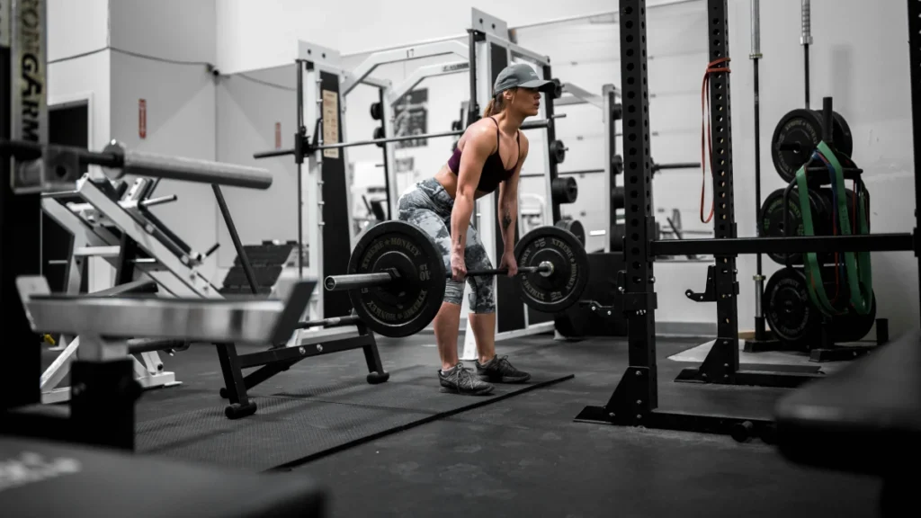 Weight lifter in weight room with rubber floor