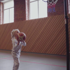 Floors for Secondary Schools image of little girls shooting a basket.