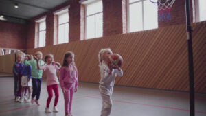 Flooring for Secondary Schools with young kids shooting baskets