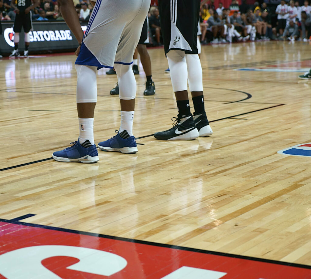 basketball shoes on a clean wood sports floor