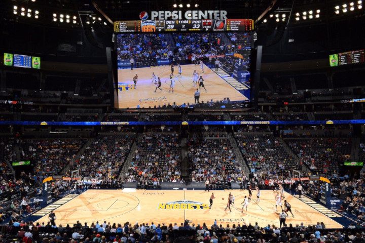 Wide image showing denver nuggets basketball court, pepsi center arena, and scoreboard used to highlight floors on the decision maker page.