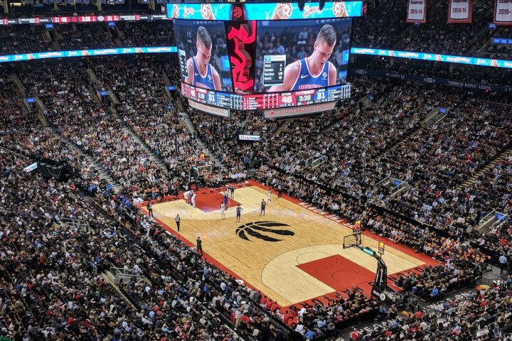 wide angle image looking down on the Toronto Raptors basketball court and Air Canada Centre used to highlight floors on the decision maker page.